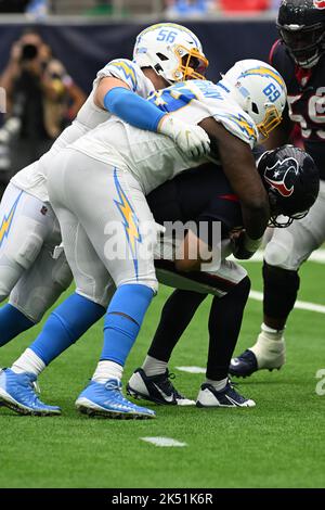 Los Angeles Chargers defensive tackle Sebastian Joseph-Day (69) and  linebacker Troy Reeder (42) tackle Seattle Seahawks quarterback Sean  Mannion (9) in the end zone for a safety during the second half of