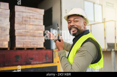 Black man, walkie talkie and logistics shipping, storage or supply chain worker. Portrait, cargo and container industry male employee with radio Stock Photo