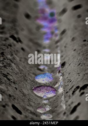 mysterious blue and purple drops on a gray background Stock Photo
