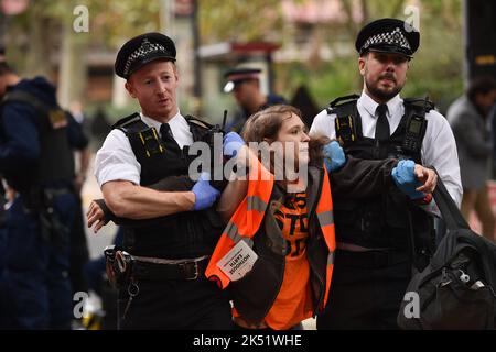 London, UK, 05th October 2022. Climate activists group Just Stop Oil blocked the roads around Millbank and Horseferry Road on the 5th day of Occupy Westminster action, demanding to halt all future licensing and consents for the exploration, development and production of fossil fuels in the UK. Credit: Thomas Krych/Alamy Live News Stock Photo