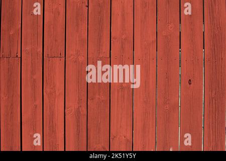 Traditional classic swedish red paint on wooden wall. Stock Photo