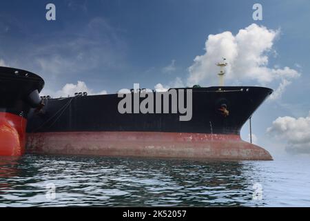 Head of a large cargo ship in the middle of the sea,Cargo ships are loading and move cargo to ship in the middle of the sea. Stock Photo
