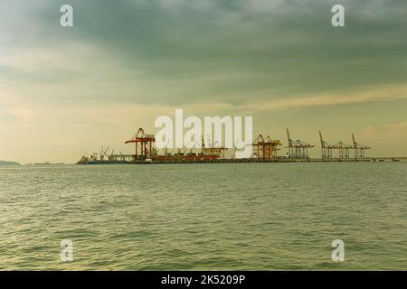 View of a working deep sea port in vintage colors, Loading and unloading of cargo ships. Stock Photo
