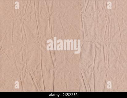 Wrinkled brown tissue paper background, Brown tissue paper with creases for design in your work. Stock Photo