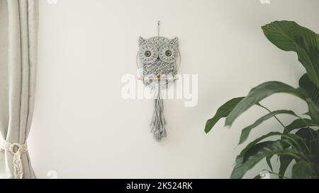 Baby Owl fine art macrame children's room wall decoration cotton cord material with macramé technique Stock Photo