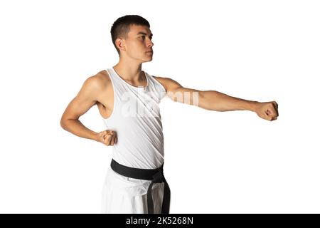 19 Year Old Practacing a Karate Stomach Punch Stock Photo
