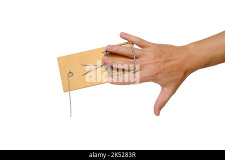 Man hand got caught in mousetrap.Isolated on white background Stock Photo