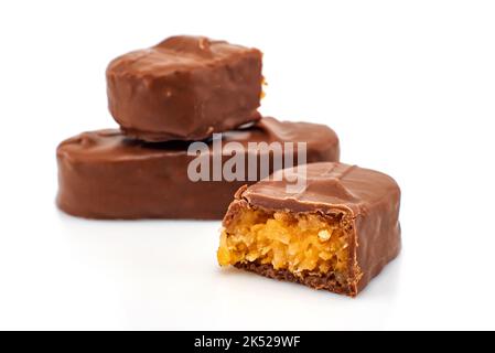 Chocolate bar with coconut on a white background. Chocolate with coconut flakes isolate Stock Photo