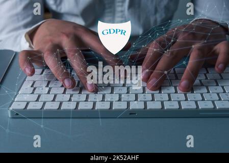 hands on computer keyboard with shield ,concept of internet security .g d p h or general data protection regulation . Stock Photo