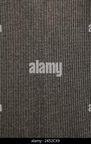 Seamless piece of textile. The texture of the fabric is dark grey. Stock Photo