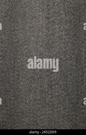 Texture of gray tweed fabric. Seamless piece of textile. Stock Photo