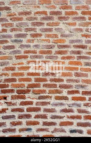 brown vintage brick wall with decayed structure. Stock Photo