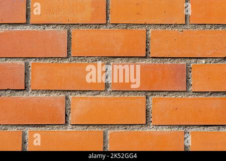 orange vintage brick wall with decayed structure. Stock Photo