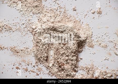 flour mixed with cocoa on isolated background, scattered powder for background Stock Photo