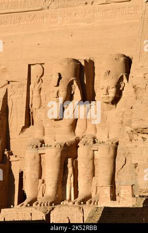 Egypt, Upper Egypt, Nubia, Abu Simbel, listed as World Heritage by UNESCO, the Great Temple known as Rameses II temple, Two of the four colossal repre Stock Photo