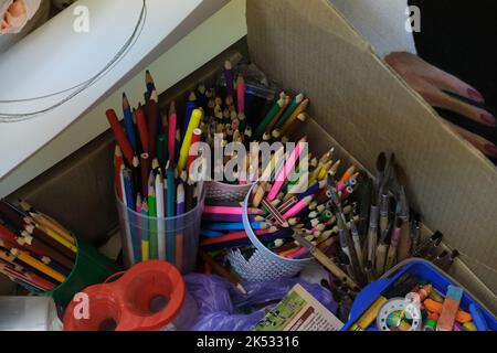 Colored pencils in a pencil case on box background Stock Photo
