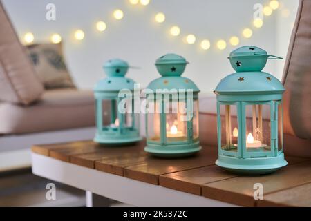 Three mint lamps at night on a table in a modern house balcony Stock Photo