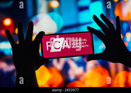 In this photo illustration, the Financial Conduct Authority (FCA) logo is seen displayed on a smartphone. Stock Photo