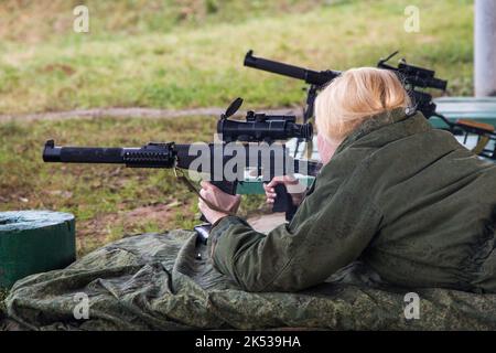 Man shooting at a target. Unformal shooting range  Stock Photo