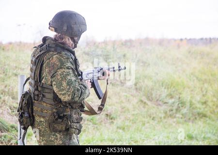 Man shooting at a target. Unformal shooting range  Stock Photo