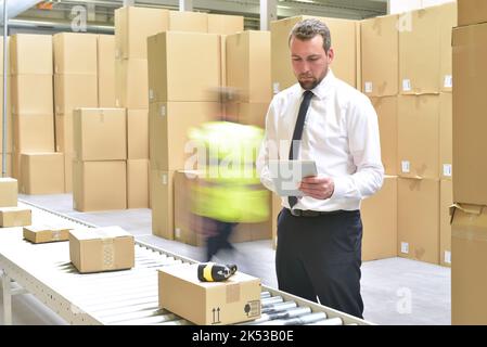 manager of a logistics company trading in a warehouse Stock Photo