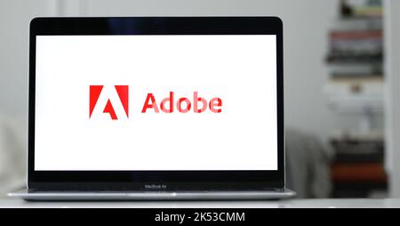 The logo of Adobe, an American computer software corporation on a laptop display Stock Photo