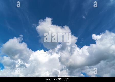 Cirrus and cumulus clouds in a blue sky. Stock Photo