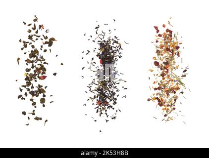 Falling dried tea leaves isolated on white background. Stock Photo