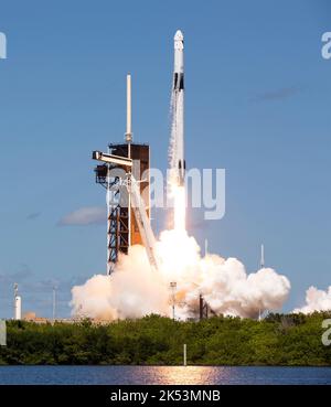 Cape Canaveral, United States of America. 05 October, 2022. The SpaceX Falcon 9 rocket with the Crew Dragon spacecraft onboard blasts off from Launch Complex 39A at the Kennedy Space Center, October 5, 2022, in Cape Canaveral, Florida. The Crew-5 mission is carrying Roscosmos cosmonaut Anna Kikina, JAXA astronaut Koichi Wakata, NASA astronauts Josh Cassada, and Nicole Mann, to the International Space Station. Credit: Joel Kowsky/NASA/Alamy Live News Stock Photo