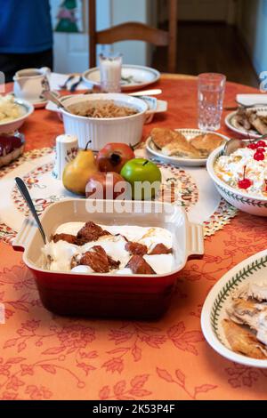 Thanksgiving Dinner Table with Many Different Food Dishes Stock Photo