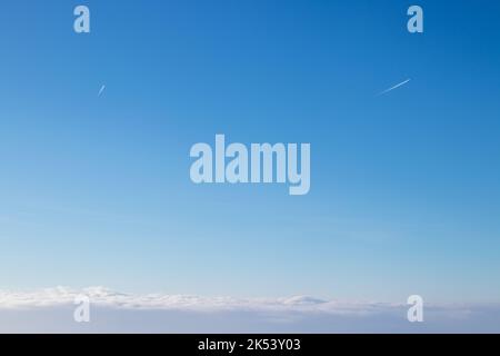 Planes leaving their tracks in the Blue Sky Stock Photo