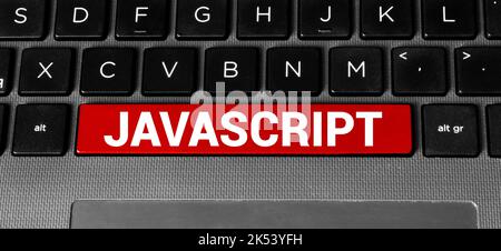 Top view of laptop with text Javascript. JavaScript inscription on laptop screen and keyboard. Learn programming language, computer courses, training. Stock Photo