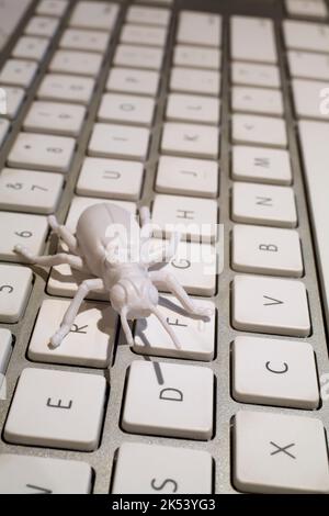Keyboard with gray computer bug. Stock Photo