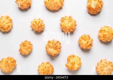 Composition with delicious eclairs on light background Stock Photo