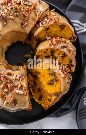 Chocolate pumpkin bundt cake with toffee glaze Stock Photo