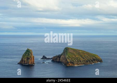 Baixo Islet, also known locally as Ilhéu do Carapacho and historically as Ilhéu dos Homiziados, is a small uninhabited islet group Stock Photo