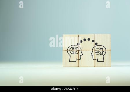 Big data and artificial intelligence concept. Machine learning and cyber mind domination concept. Human brain mind head with AI robot head symbols on Stock Photo