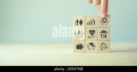 Wooden cube with health insurance icon on table background Stock Photo ...