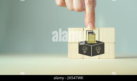 Suggestion and feedback concept. New idea, solution. Wooden cubes with suggestion box, card holder icon on grey background. Business review, strategy Stock Photo