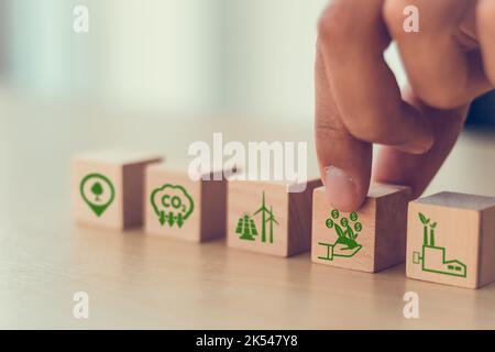 Carbon credit concept. Tradable certificate to drive industry and company in the direction of low emissions in efficiency cost.  Wooden cubes with CO2 Stock Photo