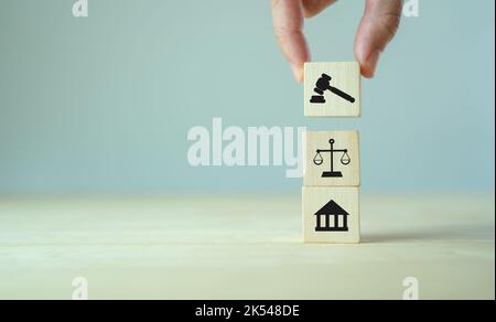 Wooden cube block shape with icon law legal justice. Law business and justice banner. Modern stacking cube block design with court, scale and justice Stock Photo