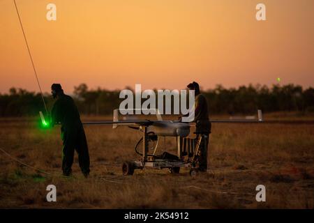 Unmanned military drone landing on runway military base Stock Photo - Alamy
