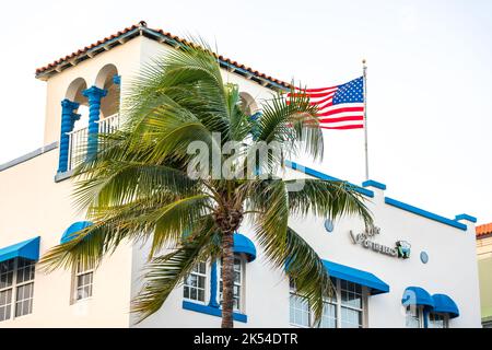 Miami, USA - September 10, 2019: Closeup of typical colorful Art Deco architecture with tropical palm tree on Ocean Drive in South Beach, Miami Stock Photo