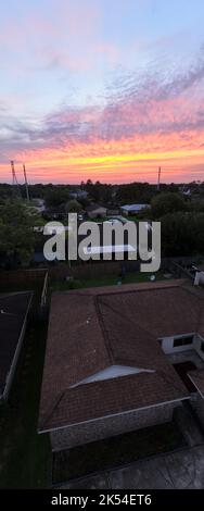 Aerial View of a Sunet over Houston with the city in the background Stock Photo