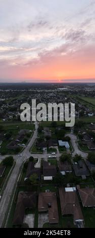 Aerial View of a Sunet over Houston with the city in the background Stock Photo