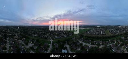 Aerial View of a Sunet over Houston with the city in the background Stock Photo