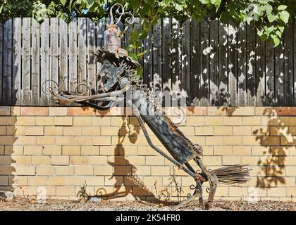 Gedera, Israel - August 27, 2022: Metal sculptures made from various objects to decorate the garden and the street. Stock Photo