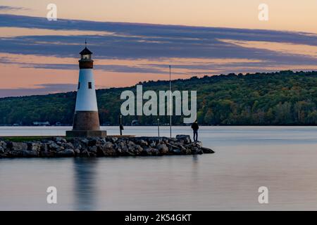 Sunset photo of the Myers Point Lighthouse at Myers Park in Lansing NY, Tompkins County. The lighthouse is situated on the shore of Cayuga Lake, near Stock Photo