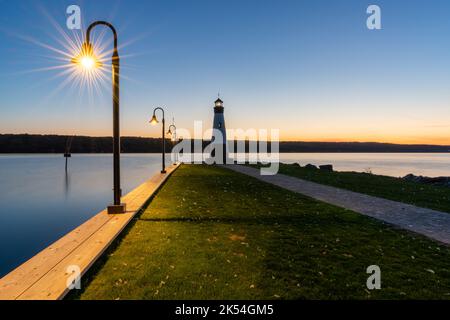 Sunset photo of the Myers Point Lighthouse at Park in Lansing NY, Tompkins County. The lighthouse is situated on the shore of Cayuga Lake, near Ithaca Stock Photo