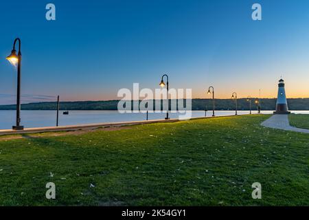 Sunset photo of the Myers Point Lighthouse at Park in Lansing NY, Tompkins County. The lighthouse is situated on the shore of Cayuga Lake, near Ithaca Stock Photo